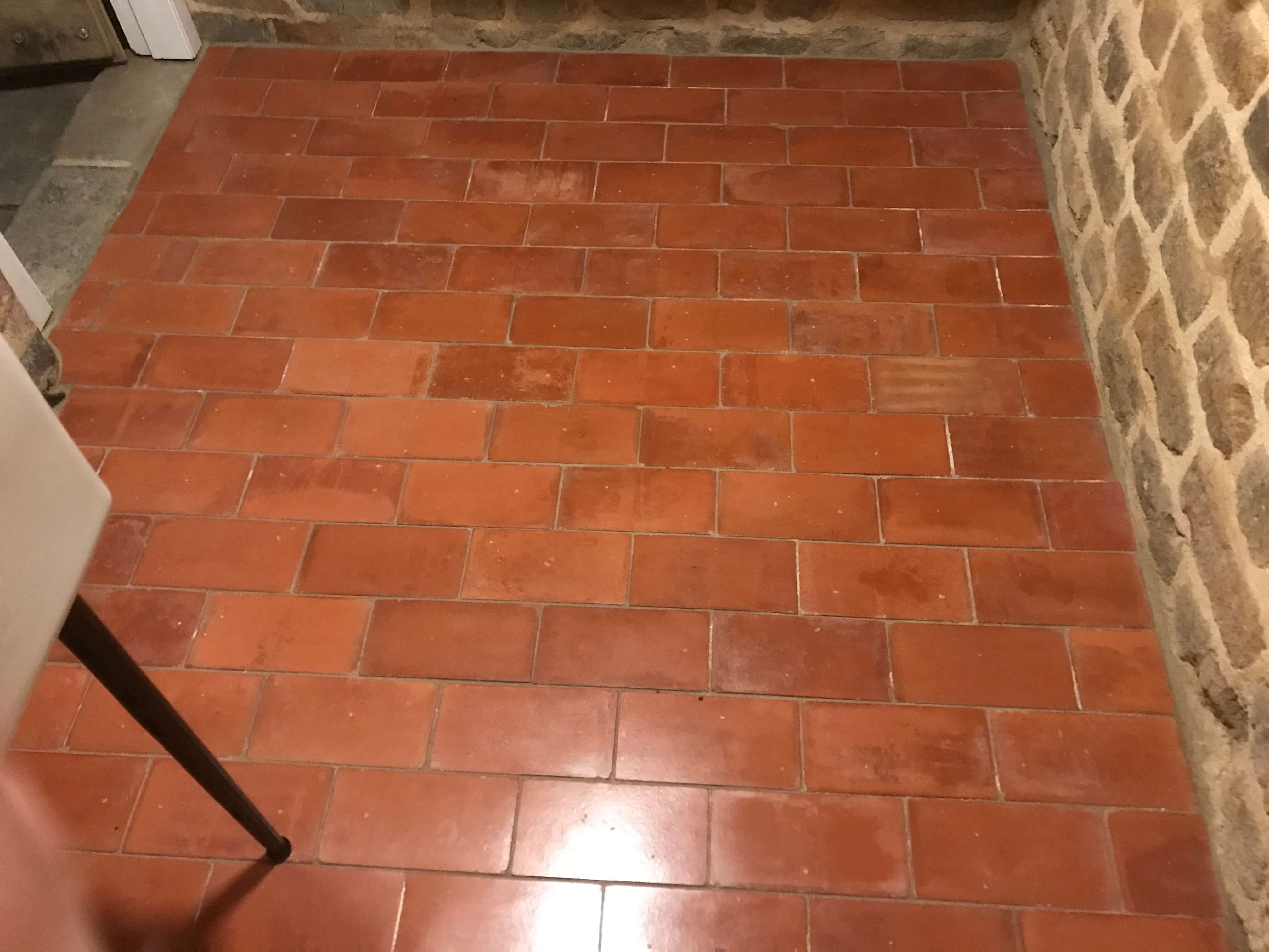 red brick matching floor and wall tiles kitchen